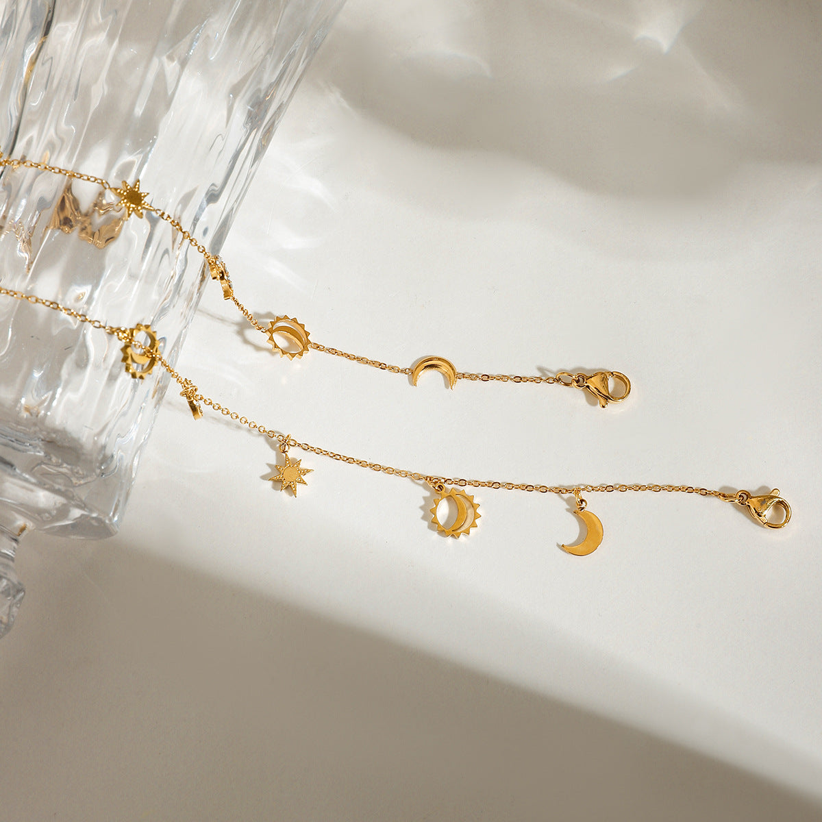 Chevillère pour femme avec breloques soleil et lune en acier inoxydable