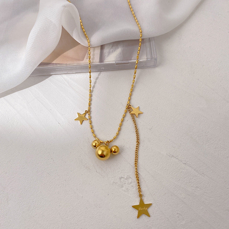 Collier pour femme avec pendentifs étoile et orbe