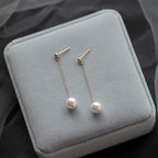 Boucles d'oreilles pendantes délicates avec perles pour femme