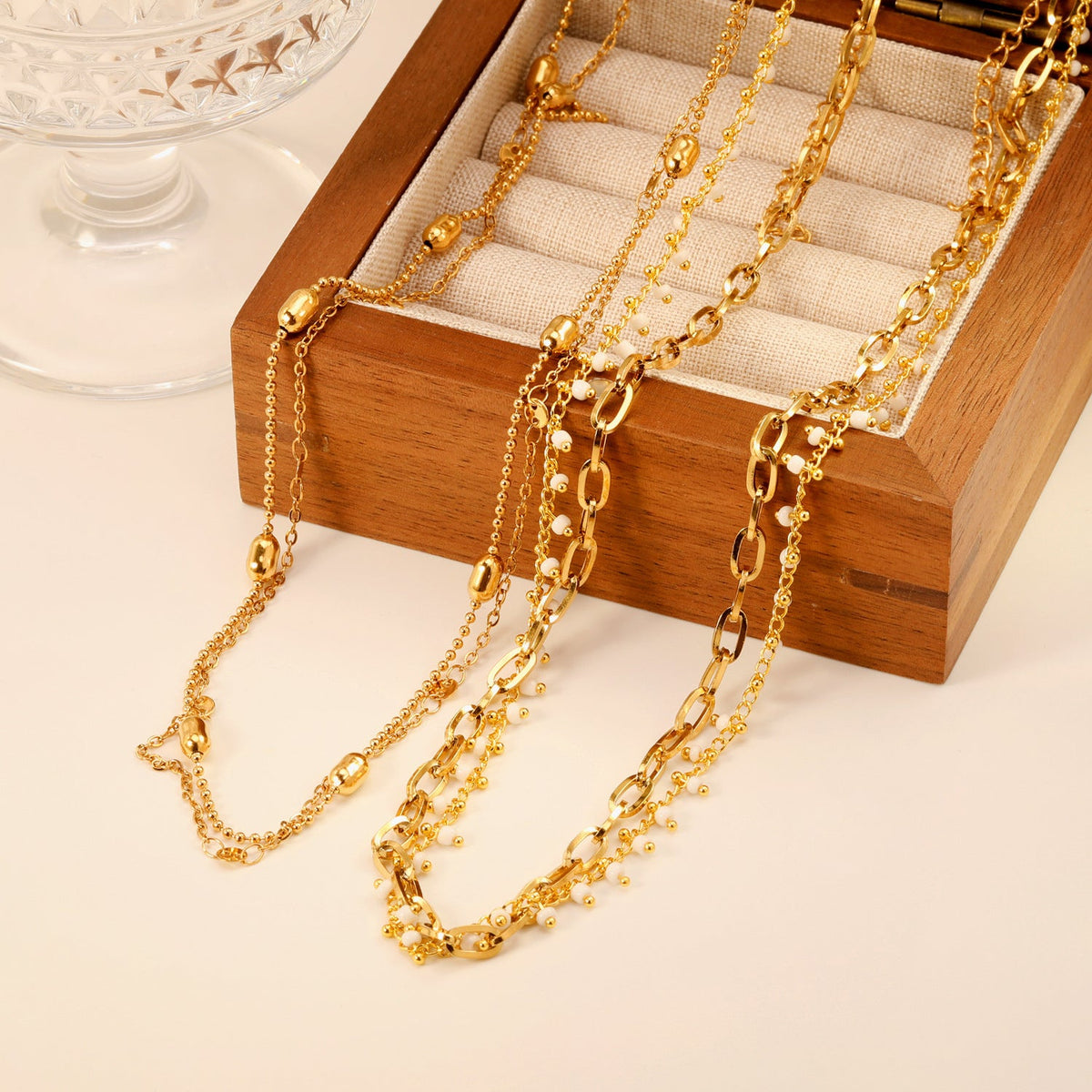 Collier pour femme avec motifs d'yeux et chaîne en acier inoxydable doré