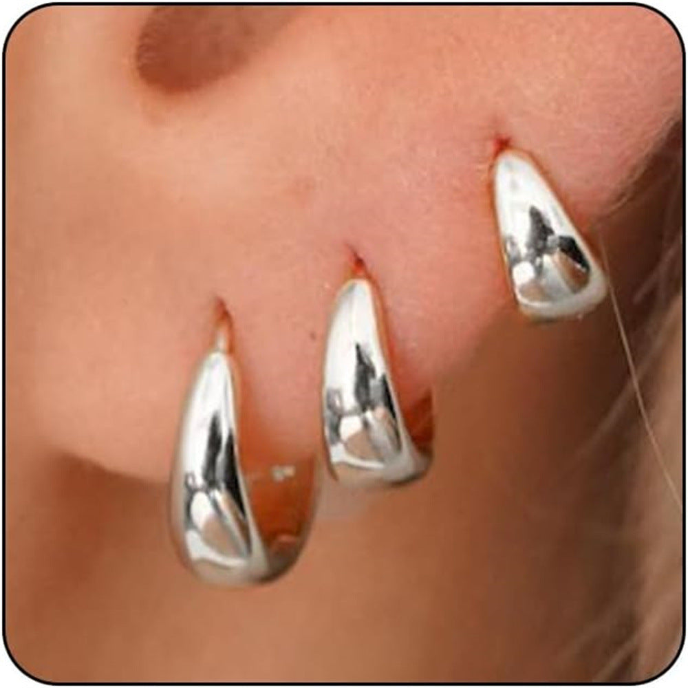 Boucles d'oreilles pendantes dorées pour femme au design goutte moderne