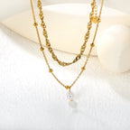 Collier multicouche pour femme avec pendentif perle et chaîne élégante