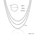 Collier multicouche pour femme avec pendentif perle et chaîne élégante