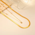 Collier pour femme avec motifs d'yeux et chaîne en acier inoxydable doré