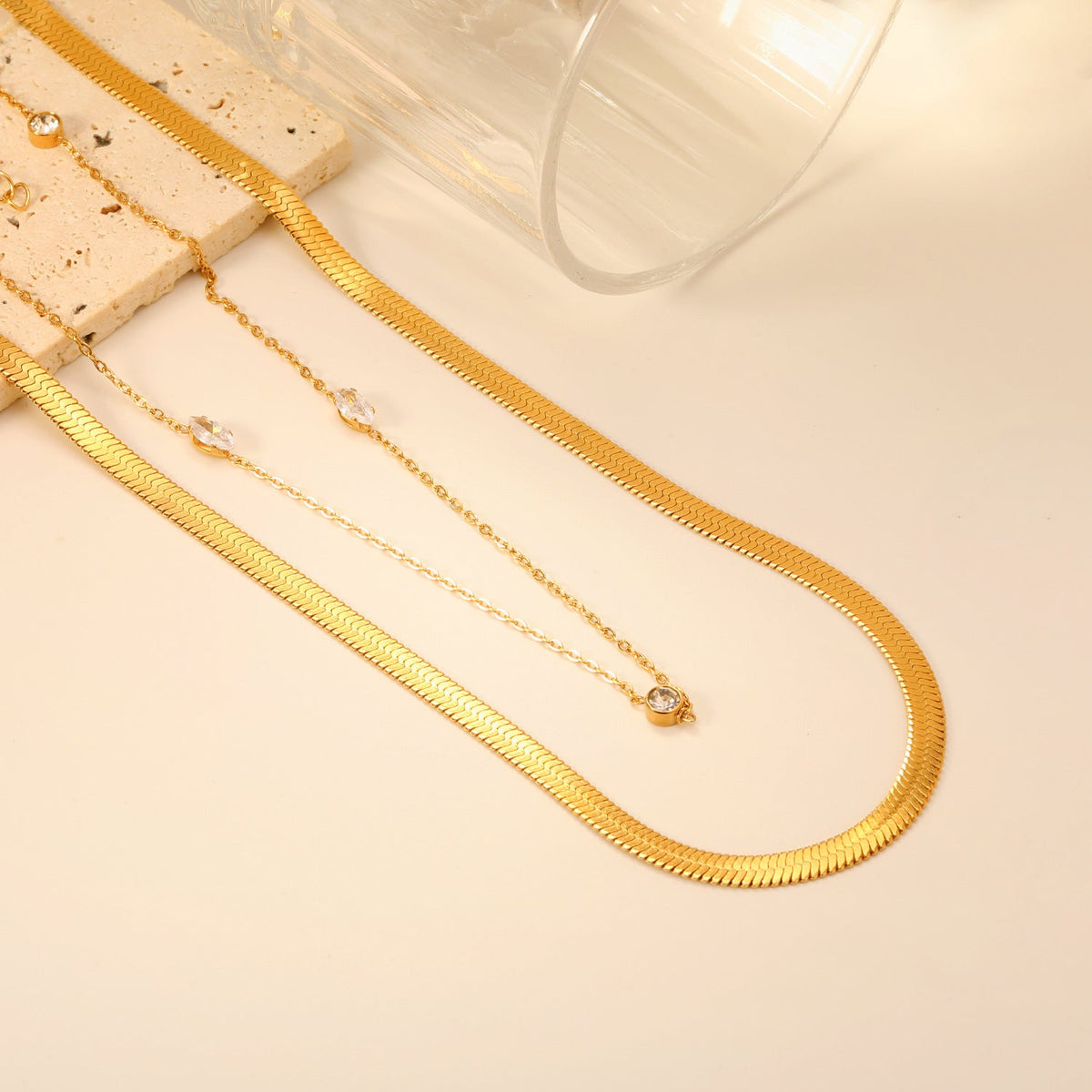 Collier pour femme avec motifs d'yeux et chaîne en acier inoxydable doré