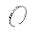 Bague ouverte avec inscription en acier inoxydable