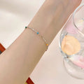 Bracelet à chaîne et perles multicolores délicat