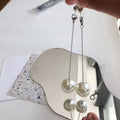 Boucles d'oreilles pendantes perles