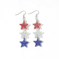 Boucles d'oreilles longues étoile en résine pailletée