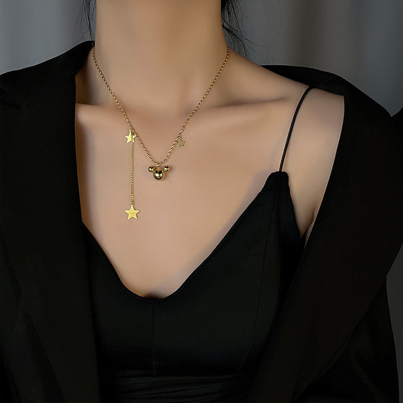 Collier pour femme avec pendentifs étoile et orbe