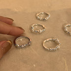 Boucles d'oreilles pour femme avec perles et design en argent