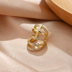 Boucles d'oreilles pendantes pour femme avec design spirale et zircone
