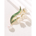 Broche fleur élégante avec pendentif perle