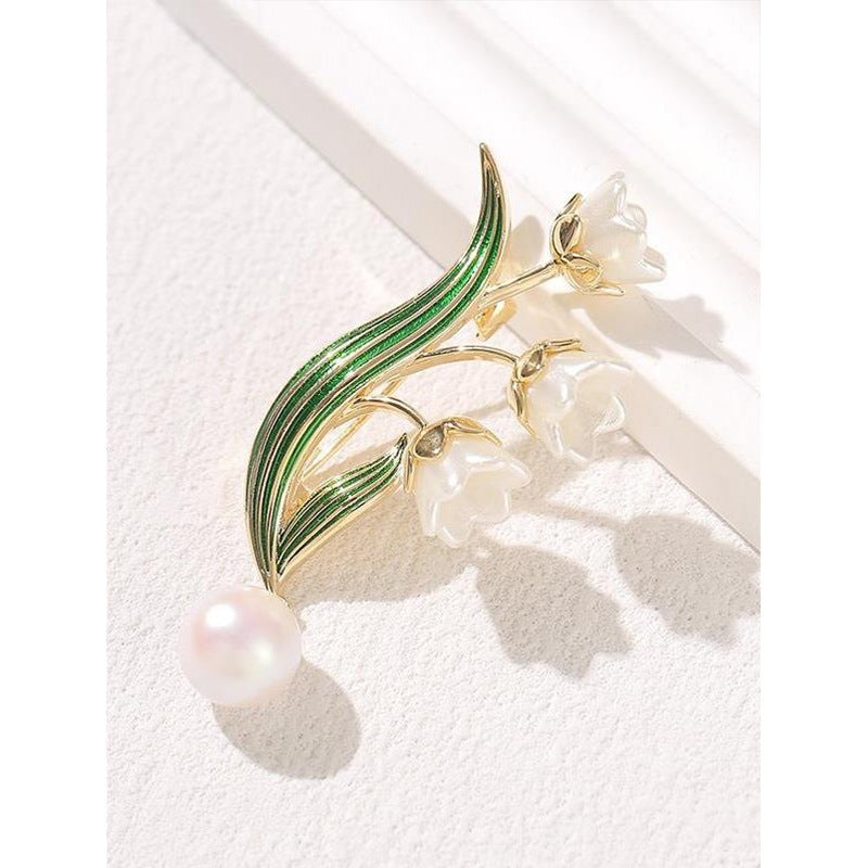 Broche fleur élégante avec pendentif perle