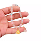 Bracelet fantaisie avec perles en verre colorées et pendentif