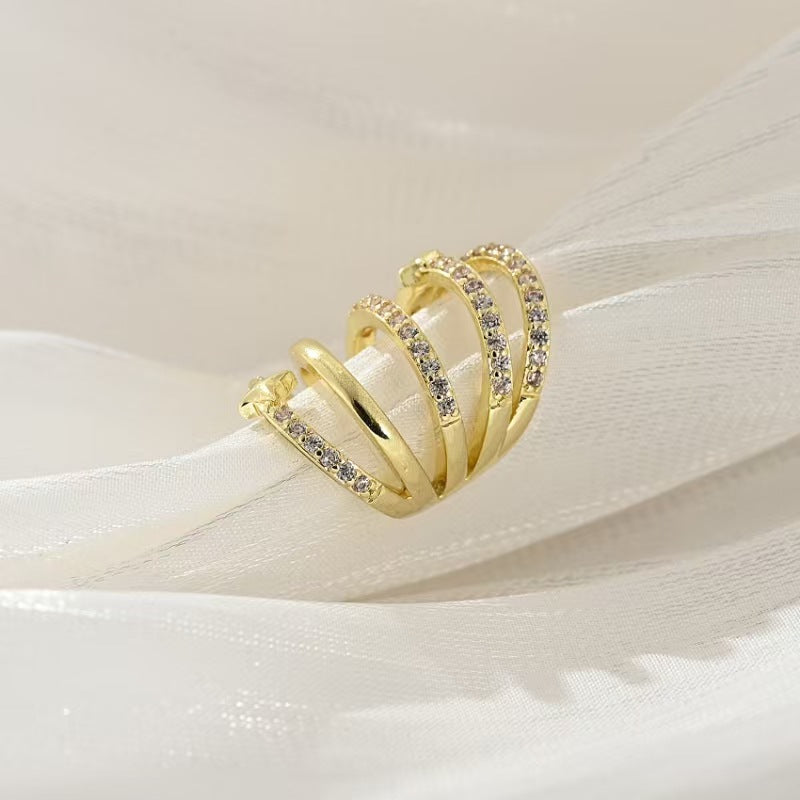 Boucles d'oreilles pendantes pour femme avec design spirale et zircone