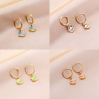 Boucles d'oreilles pendantes pour femme design planétaire en acier doré