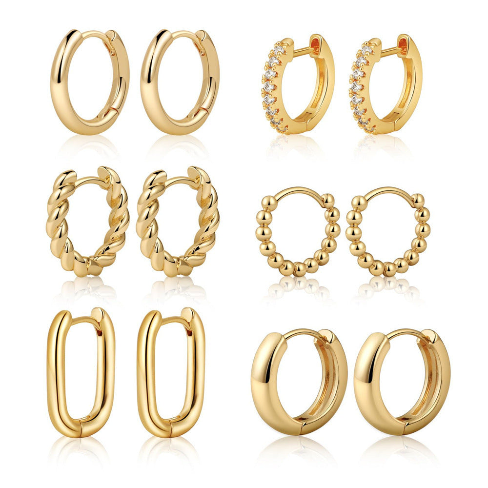 Boucles d'oreilles pendantes dorées pour femme au design goutte moderne