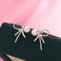 Boucles d'oreilles nœud avec perle pour femme