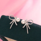 Boucles d'oreilles pour femme au design nœud et perles scintillantes