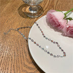 Collier ras-du-cou à breloques florales