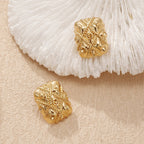 Clous d'oreilles dorés pour femme