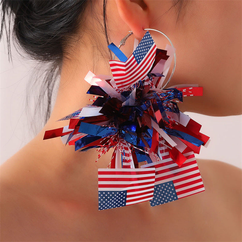 Boucles d'oreilles créoles à pompons métallisés festifs