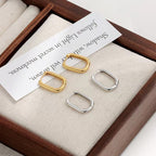 Boucles d'oreilles pendantes pour femme design sculptural