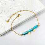 Bracelet pour femme avec éléments en pierre des Caraïbes et détails dorés