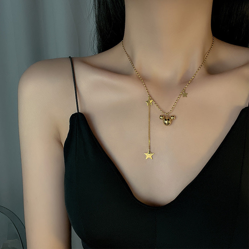 Collier pour femme avec pendentifs étoile et orbe