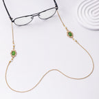 Boucles d'oreilles pendantes perles et pierres vertes