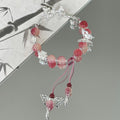 Bracelet à breloques papillon et fleurs fait main