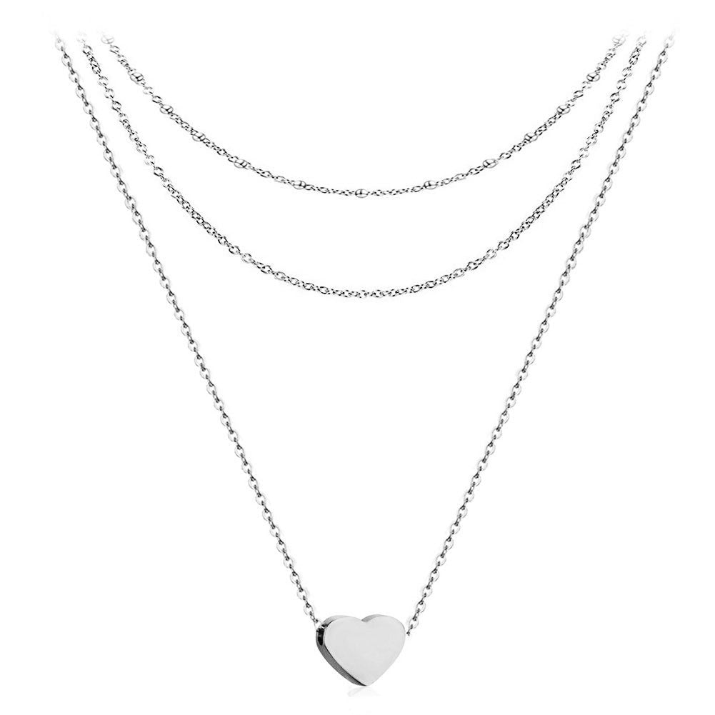 Collier pour femme avec chaînes superposées et pendentif cœur