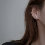 Boucles d'oreilles pour femme au design nœud et perles scintillantes
