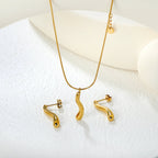 Parure de bijoux pour femme avec pendentif élégant et boucles d'oreilles