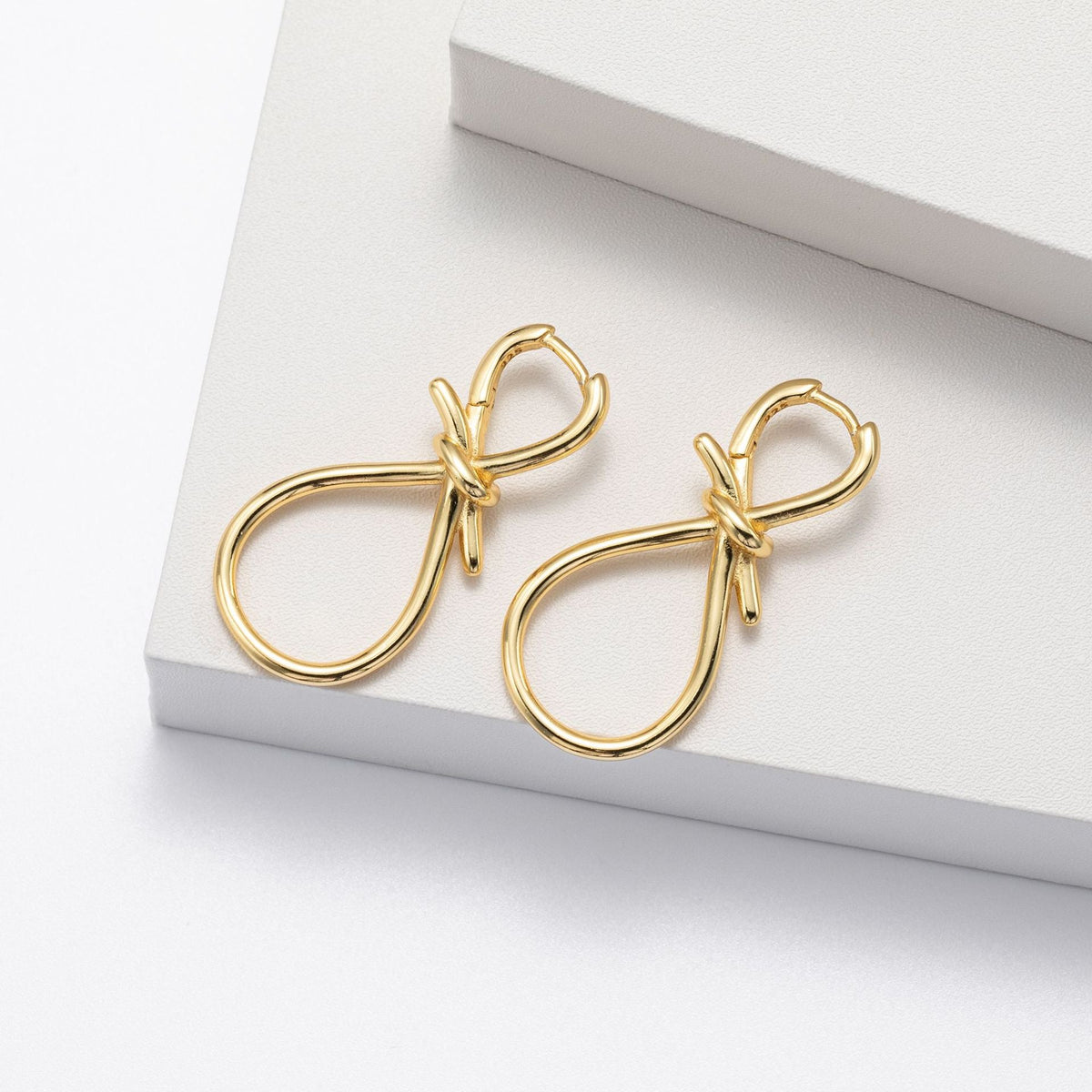 Boucles d'oreilles pendantes pour femme au design nœud en argent sterling 925
