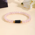 Bracelet pour femme en quartz rose avec accents noirs et dorés