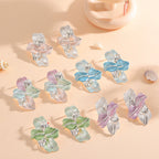 Clips d'oreilles pour femme au design élégant d'orchidée