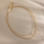 Collier multi-rangs pour femme avec pendentifs en zircone et acier inoxydable hypoallergénique