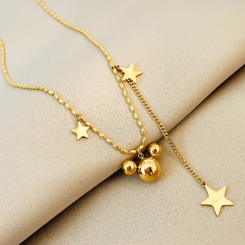 Collier pour femme avec pendentifs étoile et orbe