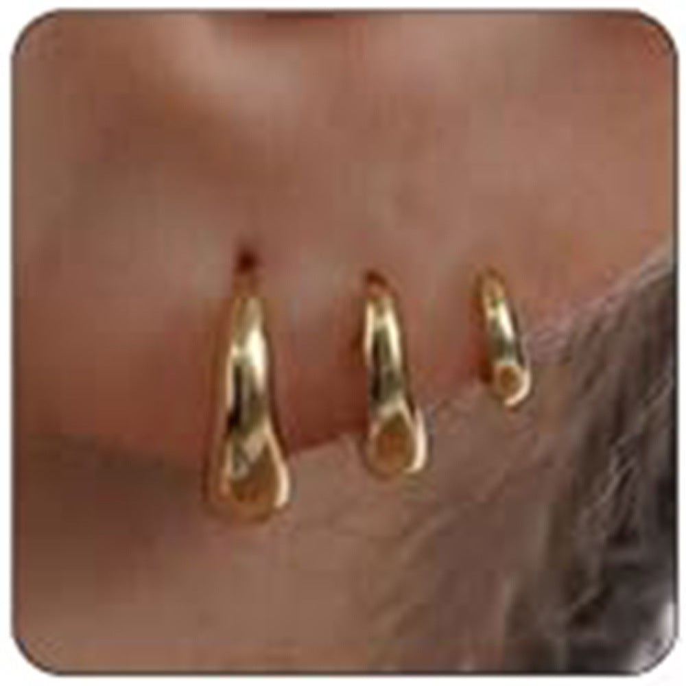 Boucles d'oreilles pendantes dorées pour femme au design goutte moderne