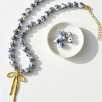 Collier décoratif pour femme avec pendentif nœud
