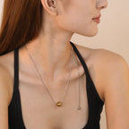 Collier pour femme avec pendentif boule réglable en acier