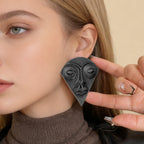 Boucles d'oreilles pour femmes avec design de visage artistique