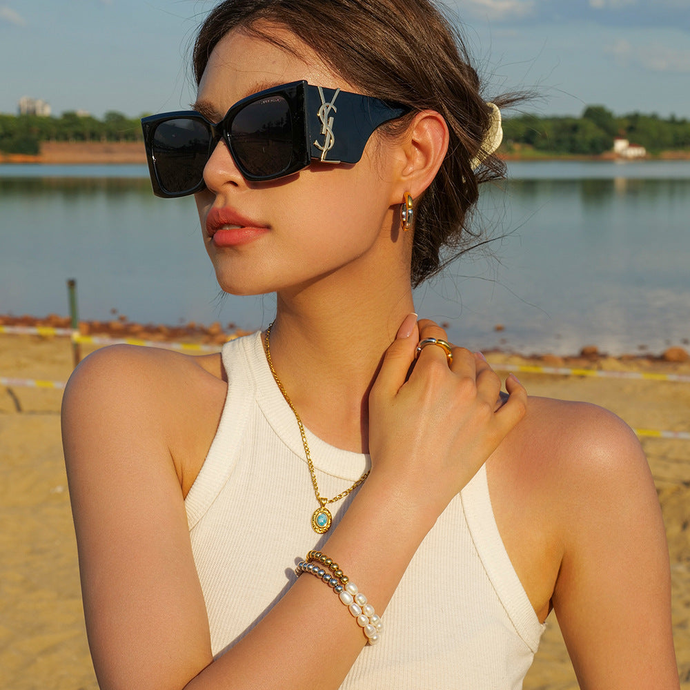 Bracelet élastique pour femme avec perles et éléments en acier inoxydable