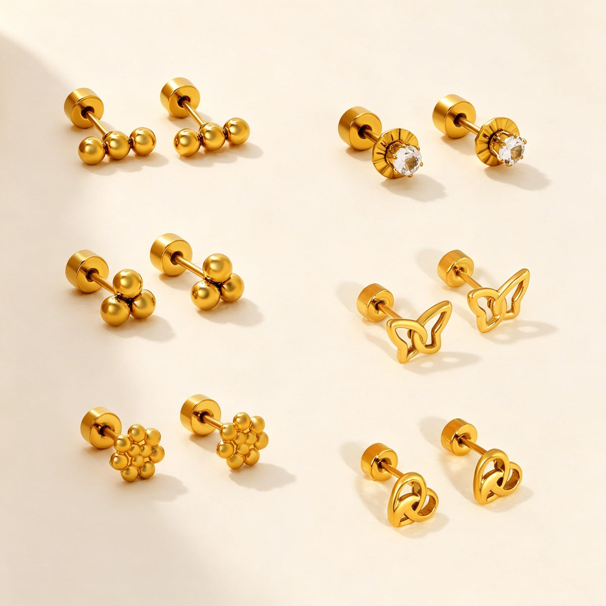 Boucles d'oreilles puces en acier inoxydable au design moderne à trois phases