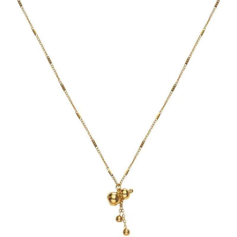 Collier délicat à breloques dorées pour femme