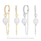 Boucles d'oreilles pendantes avec perle