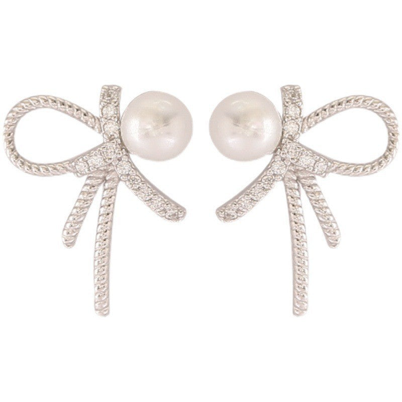 Boucles d'oreilles pour femme au design nœud et perles scintillantes