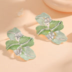 Clips d'oreilles pour femme au design élégant d'orchidée